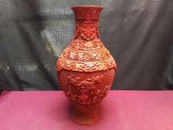 A Large Chinese Cinnebar Laquer Vase in Red. A Vary High Quality Piece with Unusually Deep and Crisp Carving of Flowers. W.20 H.38 Cm.