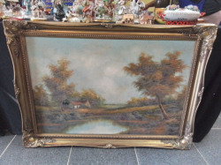 A Lovely Rural Landscape Featuring a Country Cottage Before A Lake in A Swept Gilt Frame.106x75 Cm.