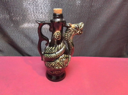 A Decorative Ceramic Decanter or Jug Featuring A Sculpted dragon design. H.24 W.14 Cm.
