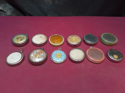 12 Thai cased amulets 