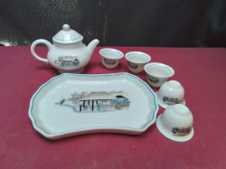 An oriental tea set including a tray 5 cups and a teapot  