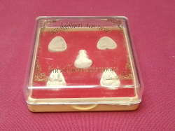 A boxed set of 5 amulets from a Bangkok temple.7x7 Cm.
