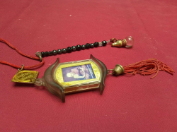 A Car Hanging Vintage Thai Amulet with Pray Beads for protection. 