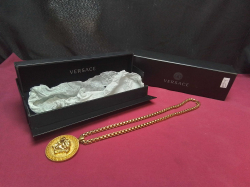 A Versace Medusa Medalian Necklace  Pendent Gold Tone with a Greek Bolder in its Original Black Box.