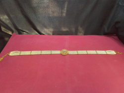 A Multi-Strand Pearl with Diamond’ sand Gold-Plated Wedding Belt. 