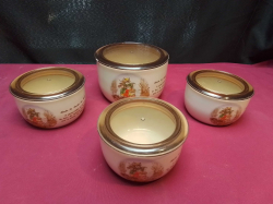 A set of four French lidded bowls with French inscriptions and Families of rabbits on
