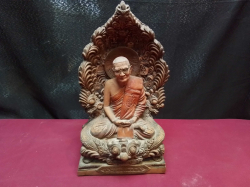 A large very heavy statue of a sat monk 