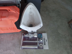 A new of men's toilet with accessories (American Standard)