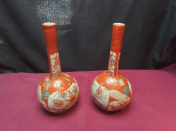 A Pair of Japanese Kutani Late 19C., 27 Cm. Tall Bottle Vases. Hand Painted Iron-Red Designs Accented with Gold. Stamped to Base one has Minor Repaired damage of neck. 
