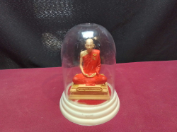 A statue of Luang Phor  Suang (L.P. Roy) in a glass dome very nice condition. W.10 H.12 Cm.