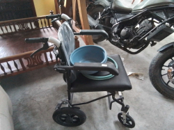 A Toilet Wheelchair complete.