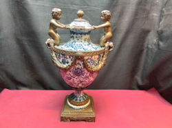 A 45 Cm. High Vintage Porcelain & Bronze Hand Painted French URN 19th Century Style Mid 20th Century Depicting Boy Cherubs Holding Lid Stamped to Base 1995 Mint Condition 