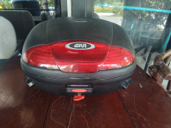 A Large Motorcycle storage box with key.
