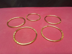5 Gold Plated Ladies Arm Bangles. 