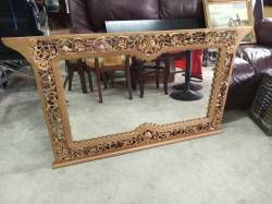 A carved wooden Wall Mirror. Approx.124x77 cm