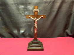 A large table standing statue of Jesus on the cross. H.12 W.14 Cm.  