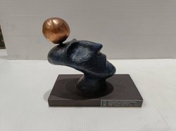An art brass sculpture on the base  