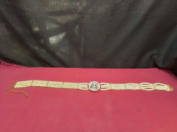 A Multi-Strand Pearl with Diamond’ sand Gold-Plated Wedding Belt. 