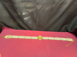 A Multi-Strand Pearl with Diamond’ sand Gold-Plated Wedding Belt. 