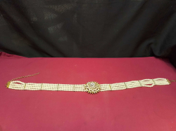 A Multi-Strand Pearl with Diamond’ sand Gold-Plated Wedding Belt. 