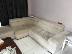 A Large Cream Fabric Sofa (adjustable to be bed) in good condition