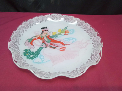 Chinese large bowl/plate showing a woman playing a instrument. W.28 Cm.