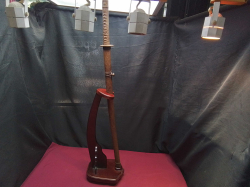 Hand painted golden samurai swords marked in a high quality stand W.18 L.24 H.98 Cm. 