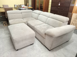 A Large Cream Fabric Sofa (adjustable to be bed) in good condition