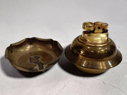 A vtg, brass lighter and a vtg small brass ashtray 