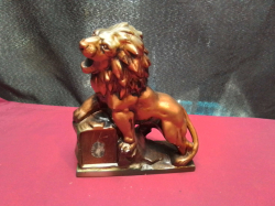 A Lion statue. W.6 L.16 H.18 Cm.