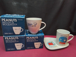 3 Collectable Snoopy mugs all boxed  and A Snoopy cup with tray has place for cup to sit on 