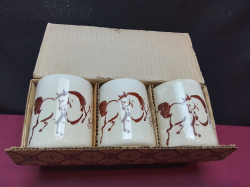 A Chinese boxed of 3 ceramic cups showing Black horses. H.8 Cm.