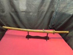 Hand painted golden samurai swords marked in a high quality stand W.18 L.24 H.98 Cm. 