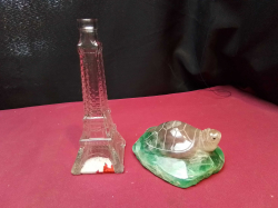 An Antique  hand crafted Turtle 1960-1970s W.10 Cm. and Eiffel Tower Glass  Decanter H.15 Cm. 