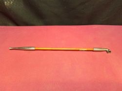 A wooden brass opium pipe. L.31 Cm.