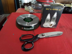 A Largd Heineken Ashtray, Large Scissors and a box of Salt& Peper Set.(3 Pieces)