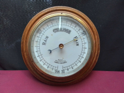 A Vintage Large and Heavy Oak and Brass Baromiter. W.26 H.6 Cm.