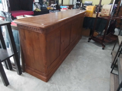 A mid-century cherry wood sideboard is designed in a French Regency Louis XVI style and features original brass hardware. D.50 L.220 H.93 Cm.