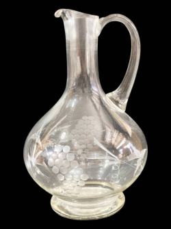 An antique large handled engraved etched glass decanter pitched. H.27 Cm.