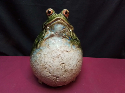 A lovely and heavy green glazed frog statue. W.20 H.27 Cm.