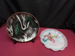 Very large old Chinese plate Chinese mark to the front plate shows a dragon W.26 Cm. comes complete on a stand and Chinese large bowl/plate showing a woman playing a instrument. W.28 Cm.