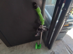 A Green Grass Trimmer 12 V.