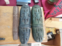 3 hand-carved wooden tribal masks or decorative panels, featuring zoomorphic motifs like crocodiles or geckos. 
Small W.7 H.43 Cm.
Large W.16 H.50 Cm.
