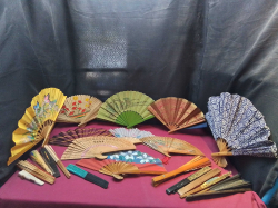 A collection of 21 features a variety of vintage Asian-style folding hand fans.
