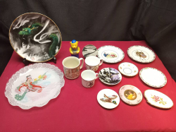 A large job lot of mugs and plates.
