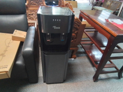 A Tixx brand bottom-loading water dispenser designed for both hot and cold water.