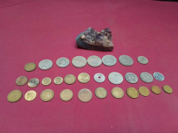 An Amethyst Stone and a selection of Coins.