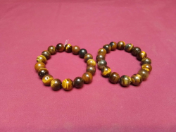 A pair of Tiger Eyes bracelet