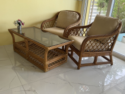 Rattan easy chairs and matching coffee table L.122 W.61 H.46 Cm.with Thai cushions