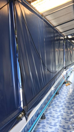 A Dark blue PVC canvas roller awning, designed for sun and rain protection. 2.5x 4 Meter 